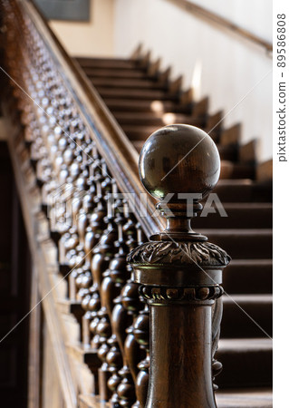 Wooden old decorative balusters, Ancient wooden stairs. decorative railings carved from wood Wooden old decorative balusters, Ancient wooden stairs. decorative railings carved from wood 89586808