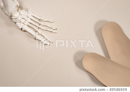 Orthopedic insoles for shoes on a colour background. Foot care Orthopedic insoles for shoes on a colour background. Foot care 89586939