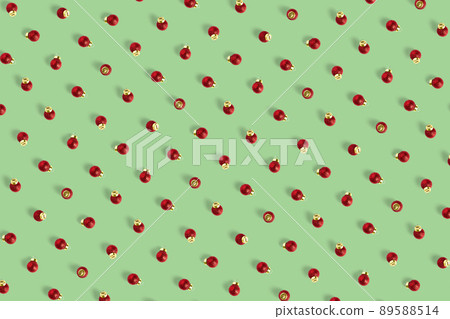 Christmas red decorations on green background. Christmas ornaments composition for background. Flat lay of red ornaments Christmas red decorations on green background. Christmas ornaments composition for background. Flat lay of red ornaments 89588514