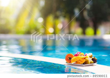 Tropical fruit at swimming pool 89590011