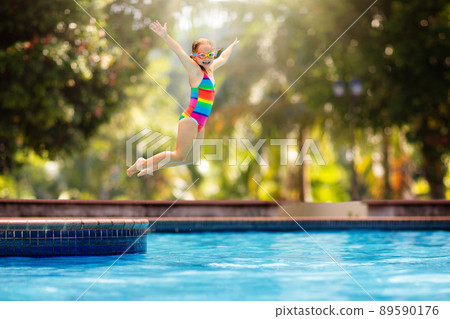 Child in swimming pool on toy ring. Kids swim. Child in swimming pool on toy ring. Kids swim. 89590176