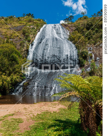 Popular cascade waterfall with tropical plants Popular cascade waterfall with tropical plants 89590999