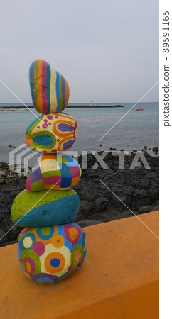 A pretty pebble stone standing alone on the Jeju Olle Trail 89591165