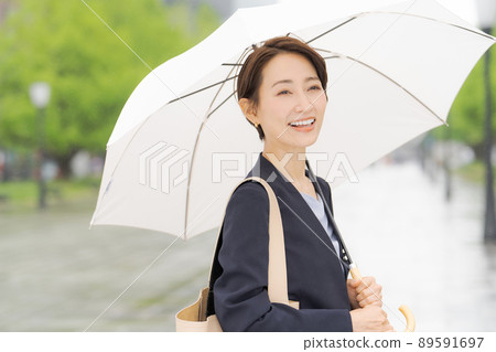 Women with an umbrella business 89591697