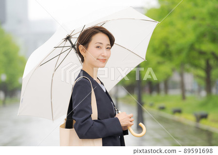 Women with an umbrella business Women with an umbrella business 89591698