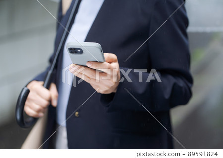 Business women outdoor rain 89591824