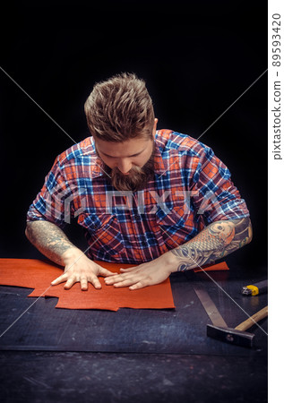 Craftsman creates a new leatherwork 89593420