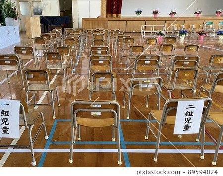 Folding chairs lined up in the gym for the ceremony Folding chairs lined up in the gym for the ceremony 89594024