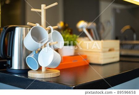 Hanging grass and cookware set on table 89596658