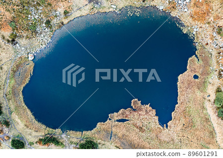 Lake Nesamovite mountain lake of the Ukrainian Carpathians, a lake in autumn. 89601291