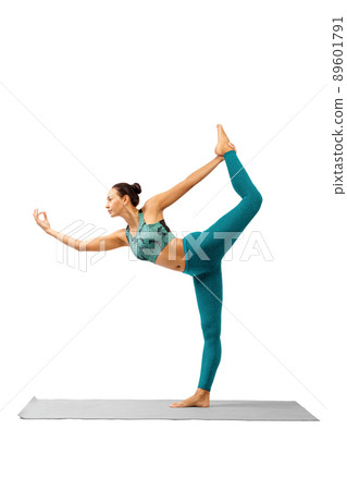 Lord of the dance pose. Beautiful asian woman in cyan sportswear practice Natarajasana exercise, isolated on white, vertical photo. Lord of the dance pose. Beautiful asian woman in cyan sportswear practice Natarajasana exercise, isolated on white, vertical photo. 89601791