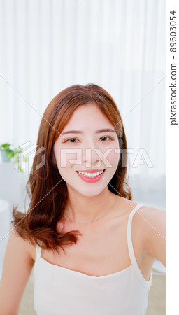asian brunette girl take selfie 89603054
