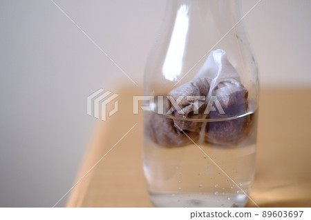Water with a cold brew coffee bag Water with a cold brew coffee bag 89603697