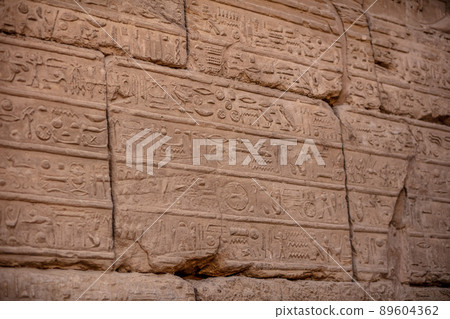 Different hieroglyphs on the walls and columns in the Karnak temple. Karnak temple is the largest complex in ancient Egypt. Different hieroglyphs on the walls and columns in the Karnak temple. Karnak temple is the largest complex in ancient Egypt. 89604362