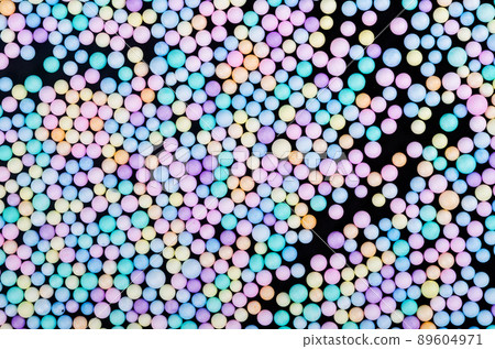 Foam beads of various colors brightly colored on black color background. Foam beads of various colors brightly colored on black color background. 89604971