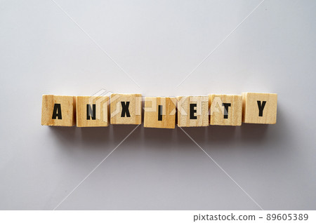 Wooden block with word ANXIETY. Mental health concept Wooden block with word ANXIETY. Mental health concept 89605389