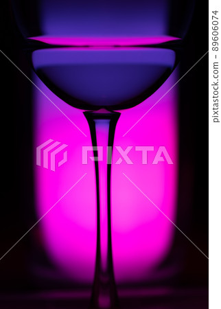 Cocktail drink on a purple background. Selective focus. Cocktail drink on a purple background. Selective focus. 89606074
