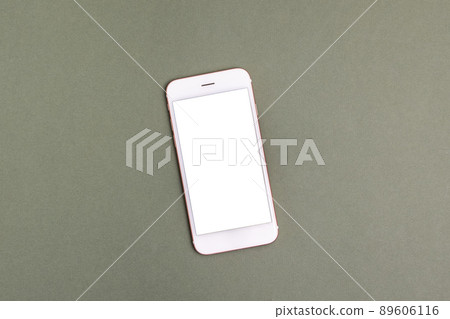 Top view of modern technology smart phone mobile on pastel green background with copy space 89606116