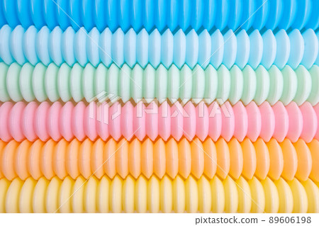 Trendy kids toys pastel colorful pop-tube on beige background. Set of forms and colors corrugated pipe and anti stressing, relaxation fidget finger toys. Trendy kids toys pastel colorful pop-tube on beige background. Set of forms and colors corrugated pipe and anti stressing, relaxation fidget finger toys. 89606198