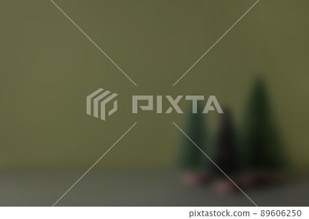 Small decorative green christmas tree on blur green background. Christmas card with a place for an inscription. Beautiful festive blurred background 89606250
