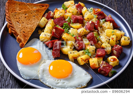 Corned Beef Hash Browns with fried eggs, top view Corned Beef Hash Browns with fried eggs, top view 89606294