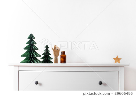 Trendy decorative Christmas trees, which made of paper with blurred house background, DIY project, Organic Modern Design, Hanging Festive Honeycomb Foldable 3D tree Trendy decorative Christmas trees, which made of paper with blurred house background, DIY project, Organic Modern Design, Hanging Festive Honeycomb Foldable 3D tree 89606496