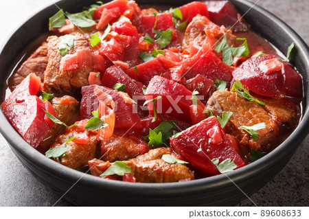 Slowly stewed beef with beets and onions in a spicy sauce close-up in a bowl. horizontal Slowly stewed beef with beets and onions in a spicy sauce close-up in a bowl. horizontal 89608633