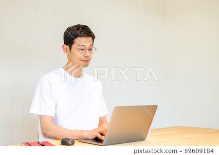 A man working on a computer A man working on a computer 89609184