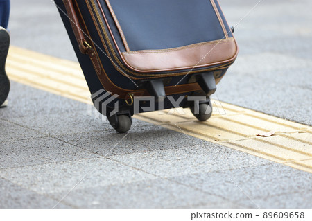 Braille blocks and pedestrians in the city 89609658