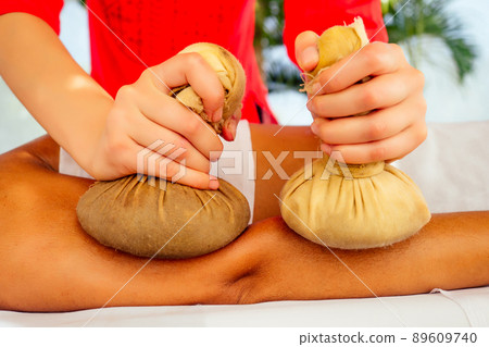indian woman getting ayurvedic massage in tropical resort in India Goa indian woman getting ayurvedic massage in tropical resort in India Goa 89609740