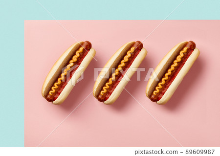 Classic hot dog with wurst, ketchup and mustard on pink table. Menu for cafe and restaurant 89609987