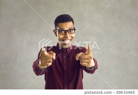 Portrait of happy black man smiling and doing You're Right or I Choose You gesture 89610468