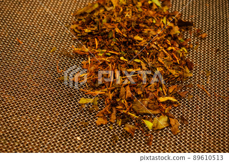 Dried tea leaves. Production line inside tea factory in India Munnar 89610513