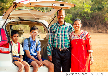 happy indian family together going to vacation on beach in Goa happy indian family together going to vacation on beach in Goa 89611719