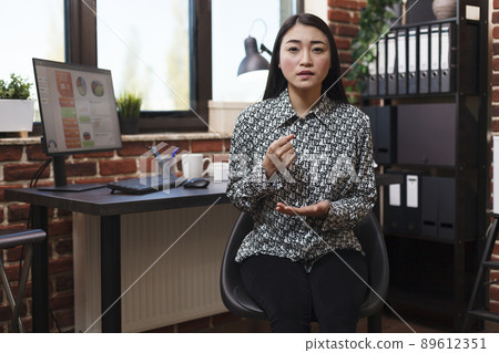 Marketing company worker in online remote chat, hand gesturing and talking about bad work results. Good looking productive asian businesswoman in video call conference explaining business plan. Marketing company worker in online remote chat, hand gesturing and talking about bad work results. Good looking productive asian businesswoman in video call conference explaining business plan. 89612351