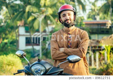 indian man wear helmet and ready to driving explore india attractions of Goa 89612731