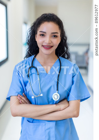 Female doctor stands at hospital. Healthcare worker.  89612977