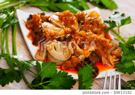 Marinated herring fillet in hunting style Marinated herring fillet in hunting style 89613182