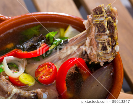 Lamb's soup boiled with lamb, vegetables, greens, onion and lemon Lamb's soup boiled with lamb, vegetables, greens, onion and lemon 89613247