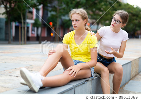 Girl asks girlfriend for forgiveness. Girl is unhappy upset there is no reluctance to talk 89613369