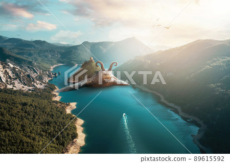 A giant sea turtleis swiming in a potemic between mountains. Unrealistic fantasy and nature concept 89615592