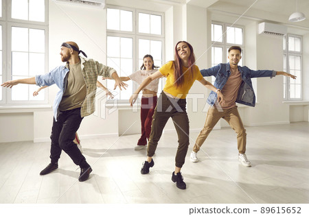 Diverse young people dancing together in studio Diverse young people dancing together in studio 89615652