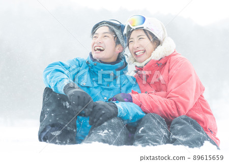Couple enjoying the snowy mountains Couple enjoying the snowy mountains 89615659