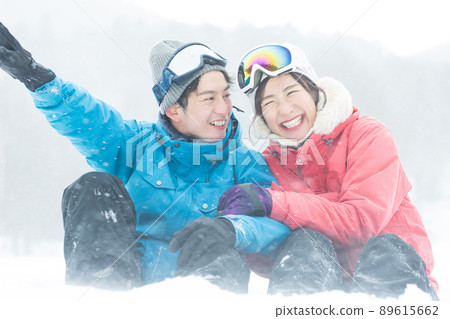 Couple enjoying the snowy mountains Couple enjoying the snowy mountains 89615662