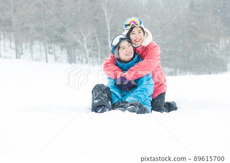 Couple enjoying the snowy mountains Couple enjoying the snowy mountains 89615700