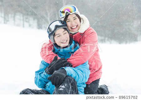 Couple enjoying the snowy mountains Couple enjoying the snowy mountains 89615702