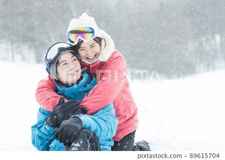 Couple enjoying the snowy mountains Couple enjoying the snowy mountains 89615704