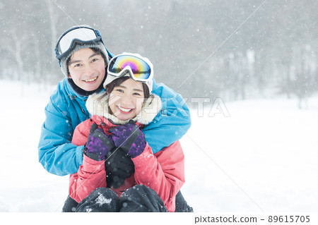 Couple enjoying the snowy mountains Couple enjoying the snowy mountains 89615705