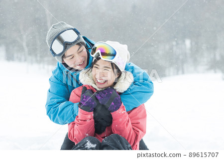 Couple enjoying the snowy mountains Couple enjoying the snowy mountains 89615707