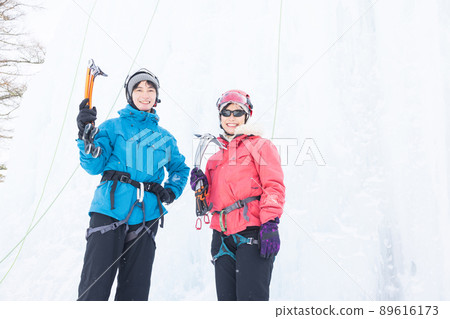 Men and women enjoying ice climbing Men and women enjoying ice climbing 89616173
